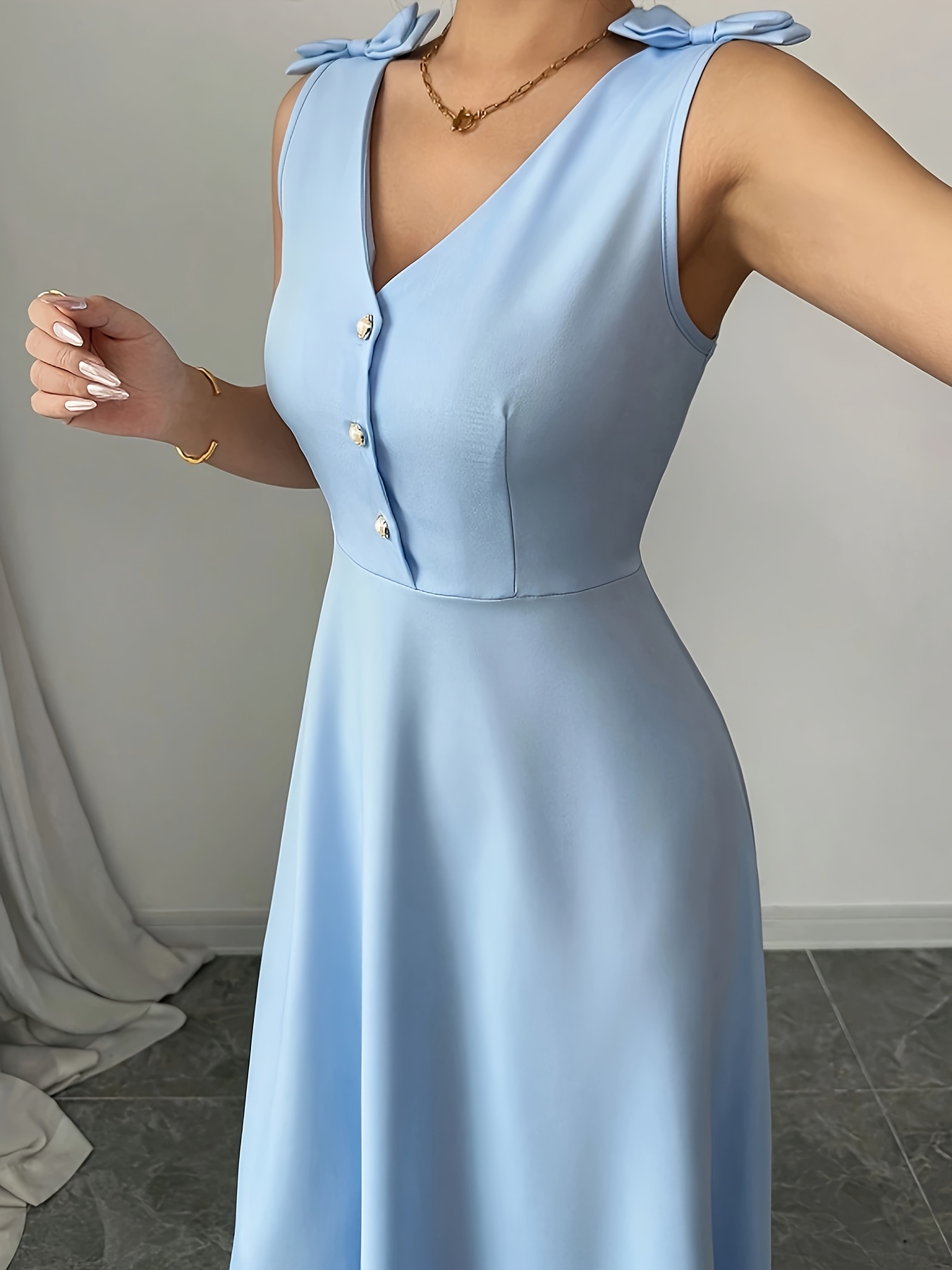 Elegant Blue Sleeveless Midi Dress with Bow Detail and Button Waist - V-Neck, Polyester, Casual Style for Women - Image 5